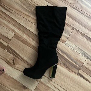 Black boots, brand new, bought them and never used them.  TORRID boots